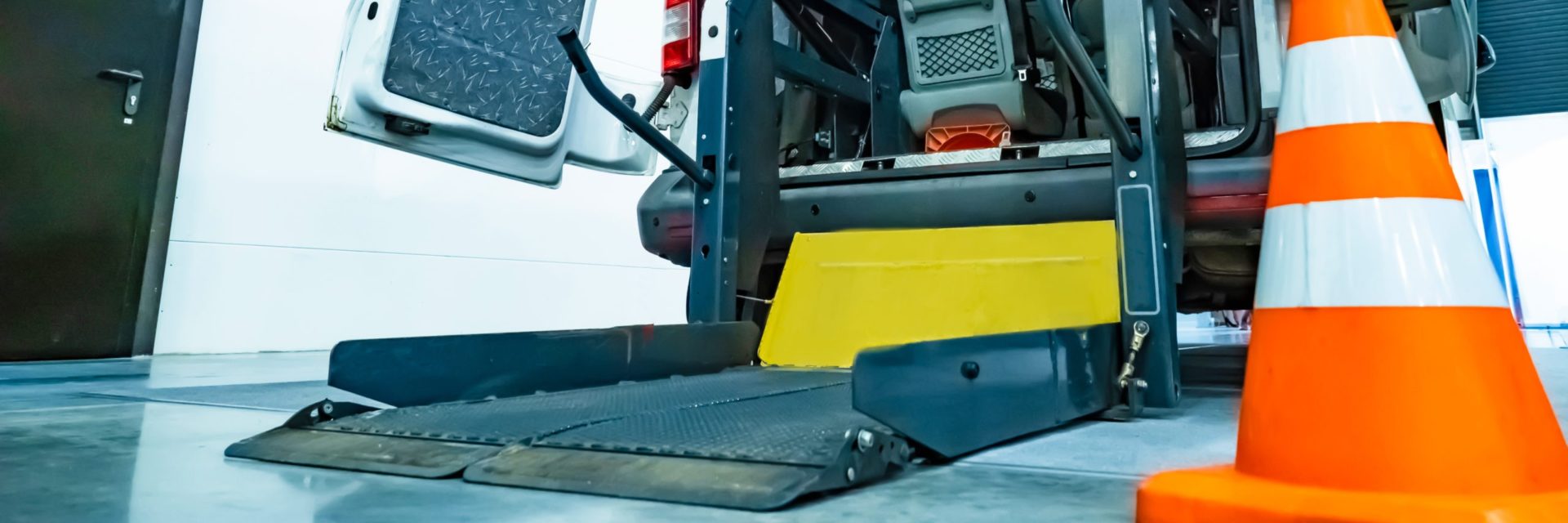 Disabled devices. Wheelchair lift mechanism. Machine equipped to transport a disabled person. Wheelchair lift into the bus.